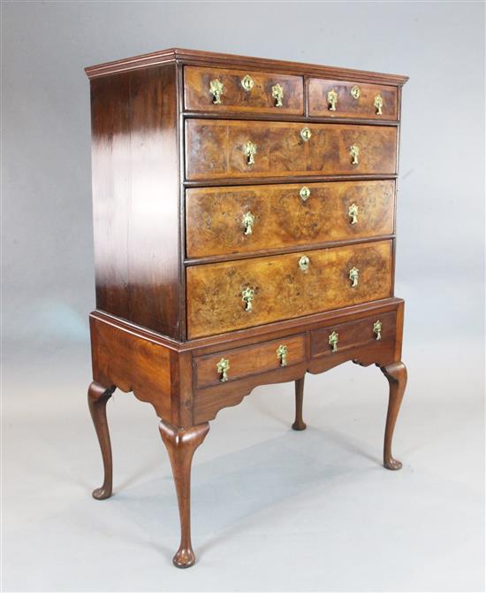 A George II featherbanded walnut chest on later stand, W.3ft 7in. D.2ft H.5ft 1in.